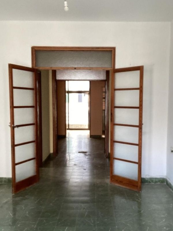 dark hallway wooden doors before renovation palma