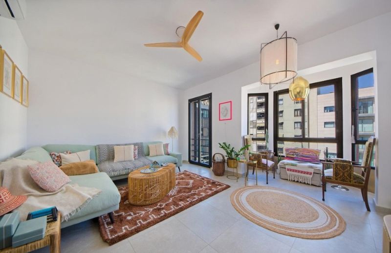 Open-plan Mediterranean living room with white arches in Mallorca.