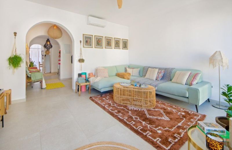 Open-plan Mediterranean living room with white arches in Palma Mallorca.